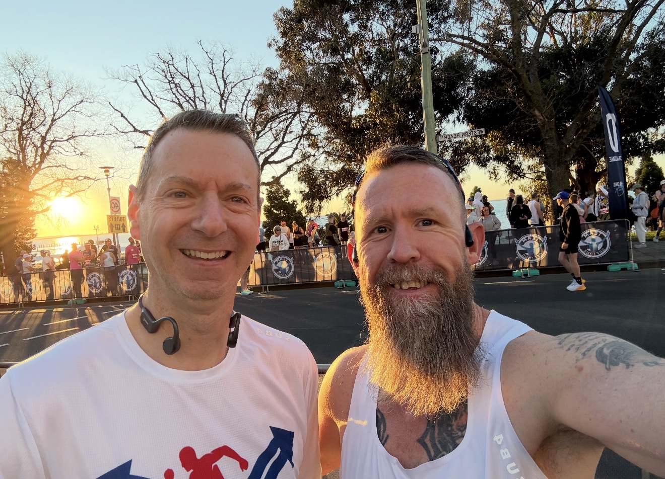 Two runners from the Two Choices community at a running event